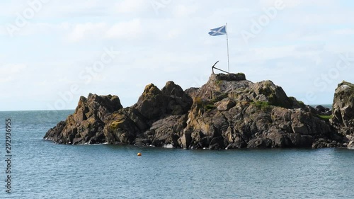Viewpoint in Portpatrick. Scenic view of ocean and Scottish flag and anchor at Harbour of Portpatrick in Dumfries and Galloway in Scotland. Sunny day in autumn in the south west of Scotland. 