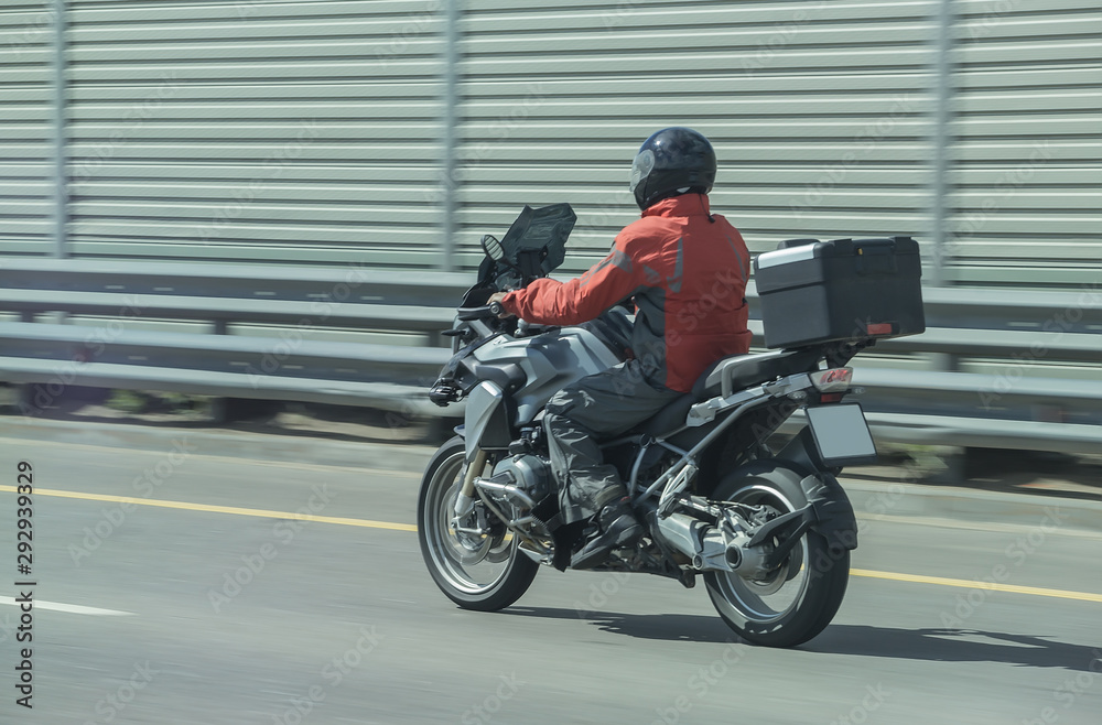 motorcyclist on motorcycle moves on city