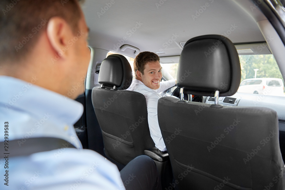 transport, taxi and people concept - male driver driving car with passenger
