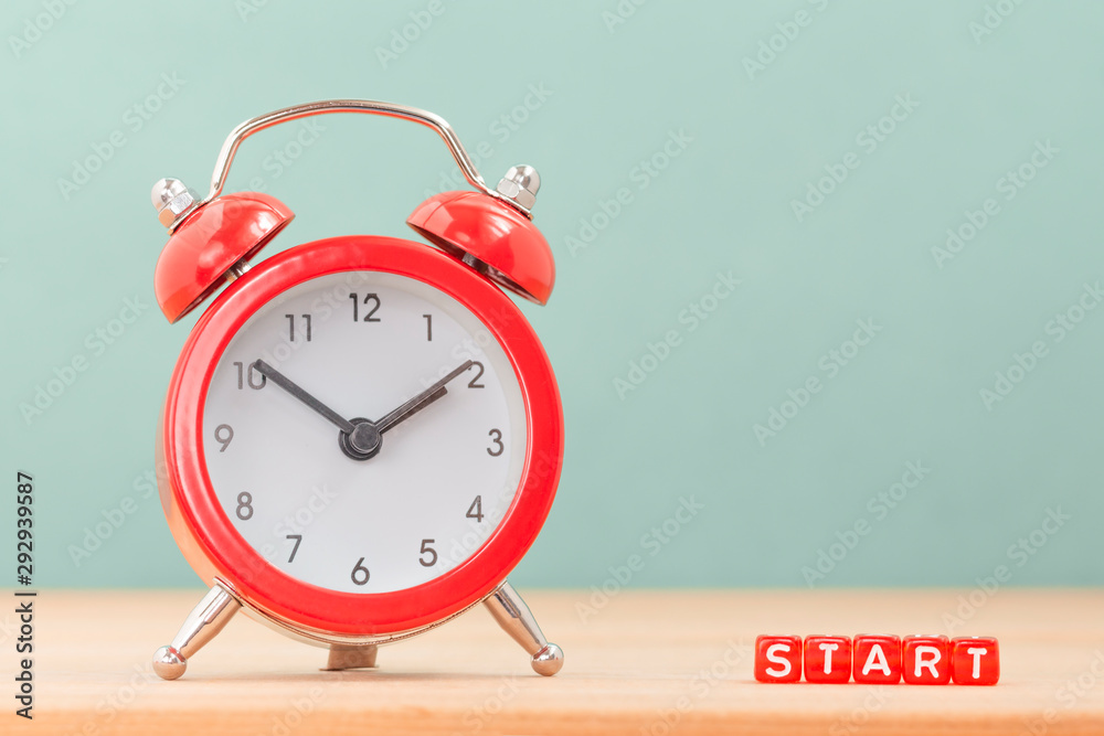 START word near red alarm clock on wooden table. Time take action. Business  concept for to begin doing or working. Photos | Adobe Stock