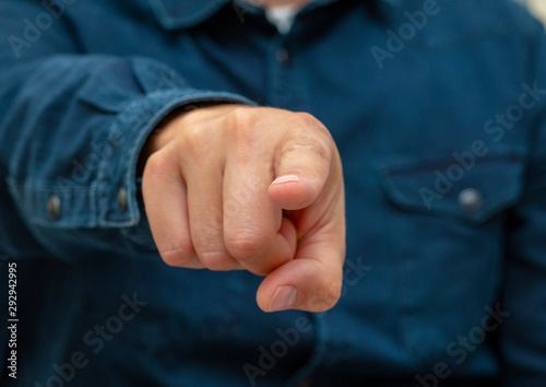 symbol with fingers on hand forefinger pointing forward, man
