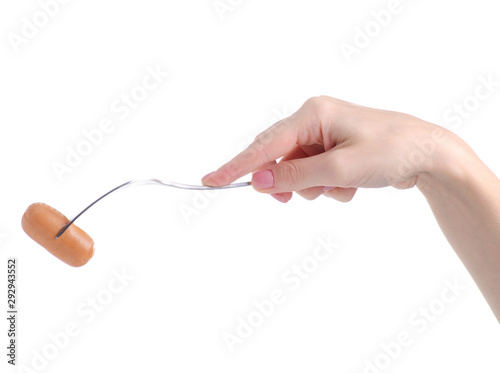 Sausage on fork in hand on white background isolation