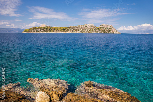 Fototapeta Naklejka Na Ścianę i Meble -  Summer sunny day beautiful view from the island of Agistri to the small island Dorousa, Aponissos bay, Saronic Gulf, Greece.