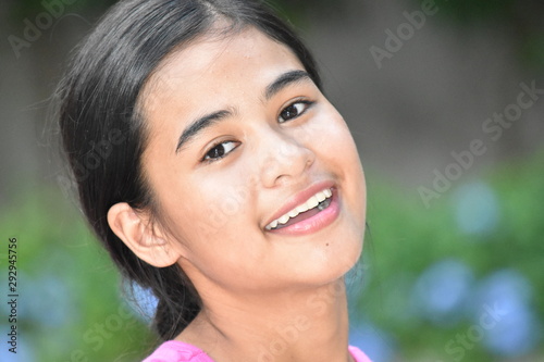 An A Smiling Youthful Filipina Female
