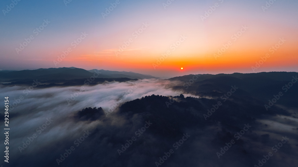 Sunrise in the morning mountains and fog
