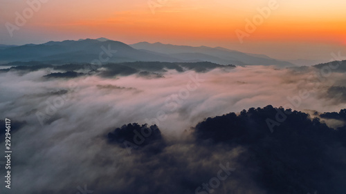 Sunrise in the morning mountains and fog