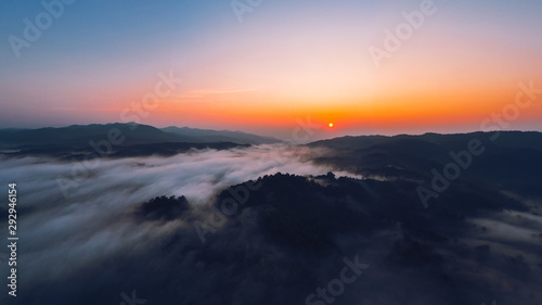 Sunrise in the morning mountains and fog