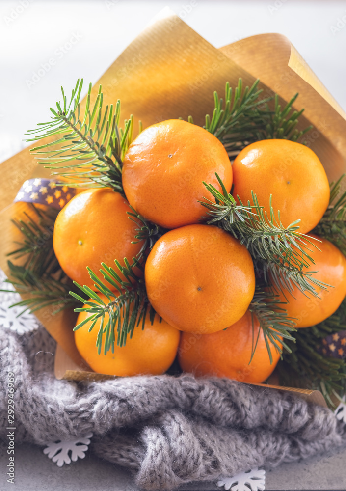 Handmade fruit bouquet of mandarin and Christmas tree branches Handmade fruit bouquet of mandarin and Christmas tree branches