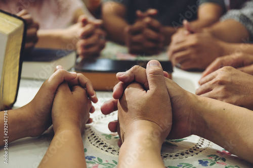 Group People hold hands to pray for God.