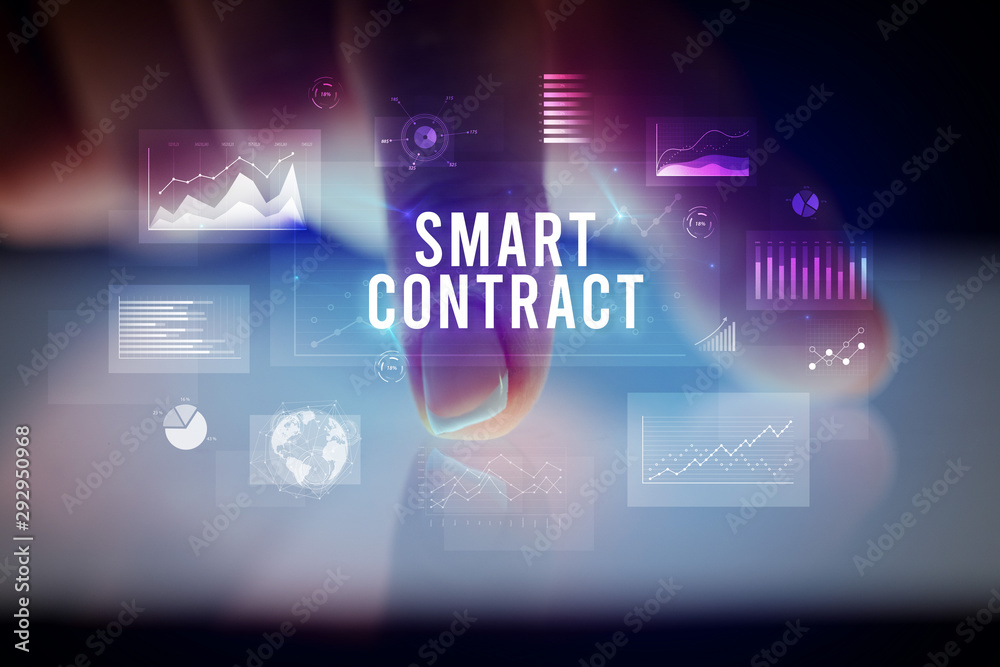 Finger touching tablet with charts and SMART CONTRACT inscription, business concept Finger touching tablet with charts and SMART CONTRACT inscription, business concept