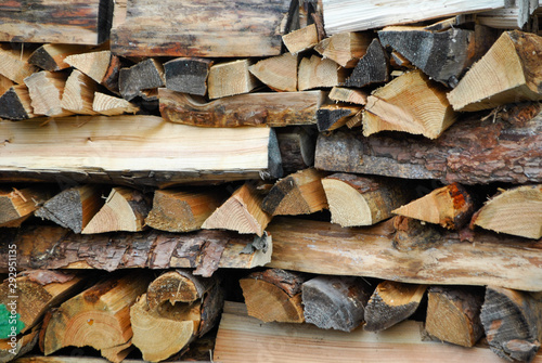 a wood pile outside a house