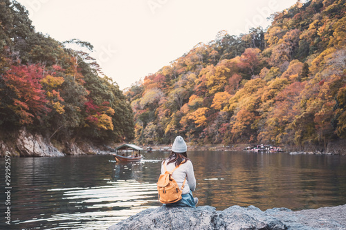 Young woman traveler looking beautiful landscape at arashiyama Japan  Travel lifestyle concept