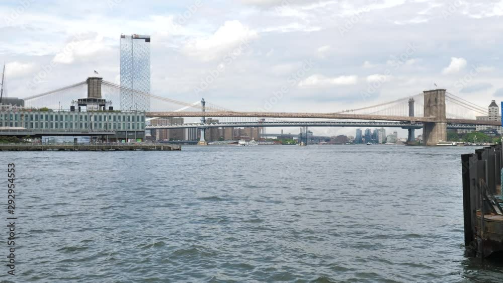 New York, Brooklyn Bridge and East River Overview From Seaport Pier, Pan Slowmotion Shot New York, Brooklyn Bridge and East River Overview From Seaport Pier, Pan Slowmotion Shot