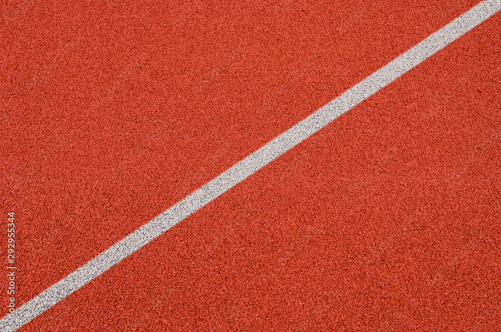 Top view of the running track rubber lanes cover texture with white line marking for background.