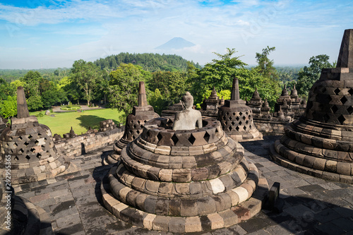 Buddha statues and stupas at Borobudur temple, Regency, Muntilan, Central Java, Indonesia  photo