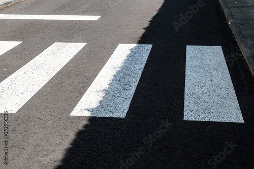 Zebra crossing in a sunshine and shadow