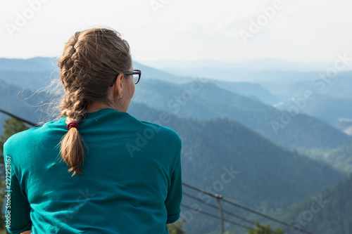 Woman standing and looking ...
