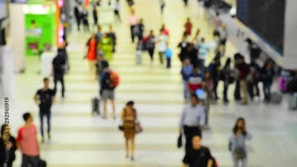 Out of focus unidentified people waking in airport terminal. Out of focus unidentified people waking in airport terminal.