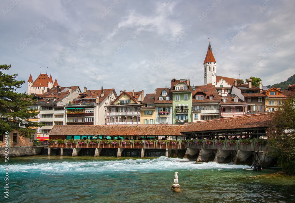 Untere Schleuse, a historical landmark, a cover bridge  also function as river lock below in Thun, Switzerland.