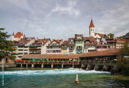 Untere Schleuse, a historical landmark, a cover bridge  also function as river lock below in Thun, Switzerland. photo