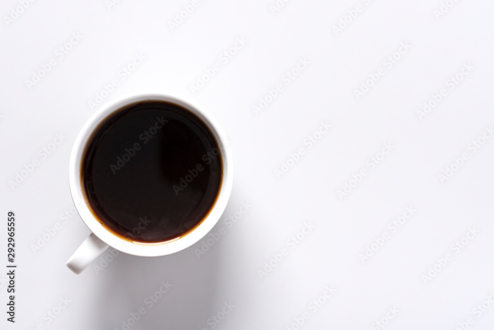 Espresso coffee in a white cup on a grey background, top view, copy space, flat lay.