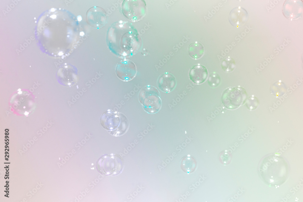 beautiful soap bubbles on colorful background