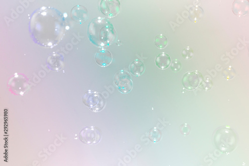 beautiful soap bubbles on colorful background