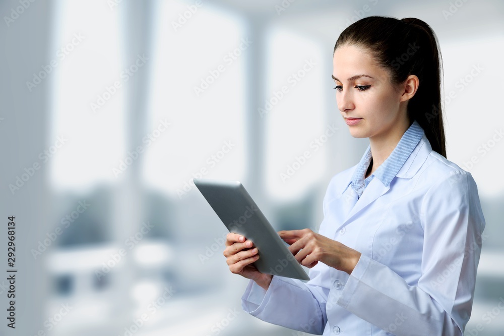 Male doctor with stethoscope on blurred hospital Male doctor with stethoscope on blurred hospital