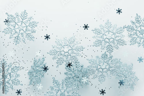 Festive winter background with decorative snowflakes in flying. Christmas, Wi...