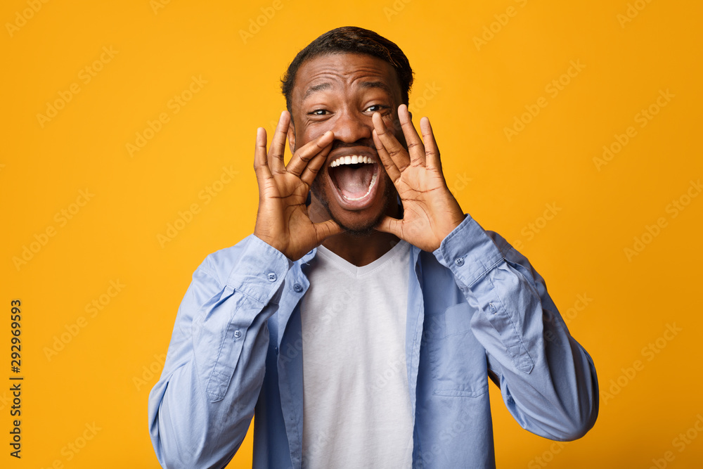 Black Guy Screaming Holding Hands Near Mouth, Studio Shot Black Guy Screaming Holding Hands Near Mouth, Studio Shot
