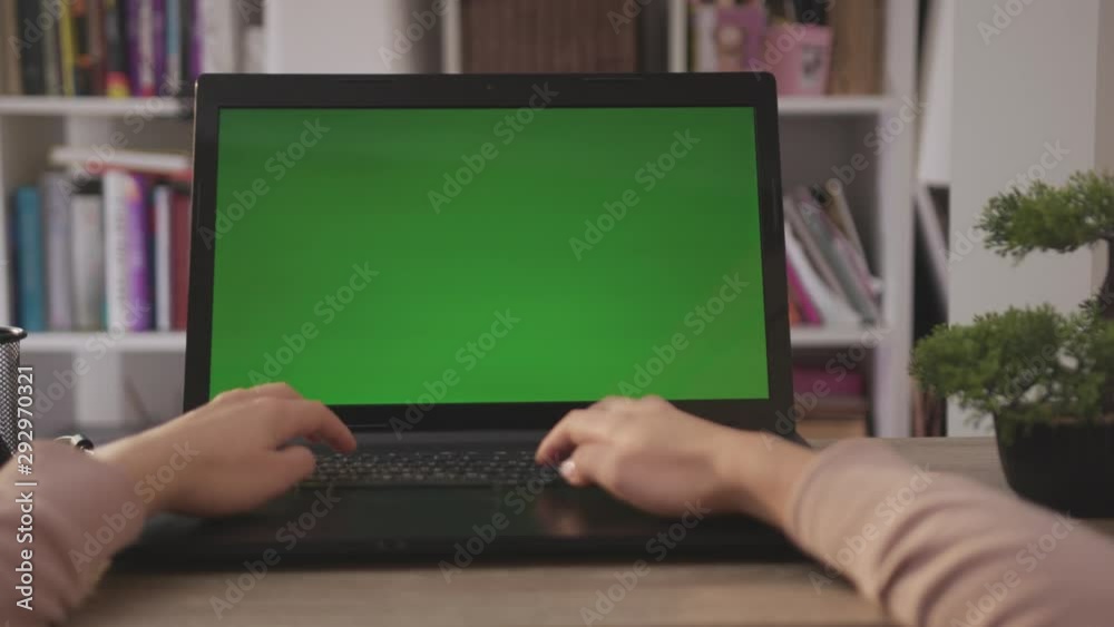 Close-up Woman Works on a Laptop Computer. Female hands Keyboarding Laptop Using Texting Pointing Networking. Green Screen. Chromakey. Shoulder Camera Shot. Living Room. Shot on Cinema Camera Arri Close-up Woman Works on a Laptop Computer. Female hands Keyboarding Laptop Using Texting Pointing Networking. Green Screen. Chromakey. Shoulder Camera Shot. Living Room. Shot on Cinema Camera Arri