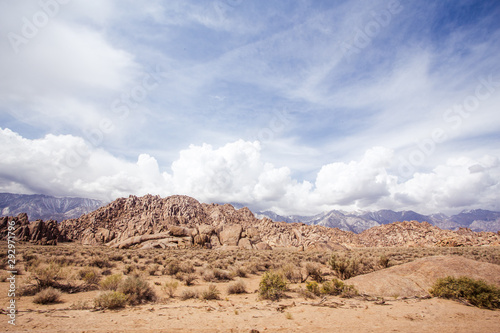 Desert landscape with mountains in the distance © Shawn Tron