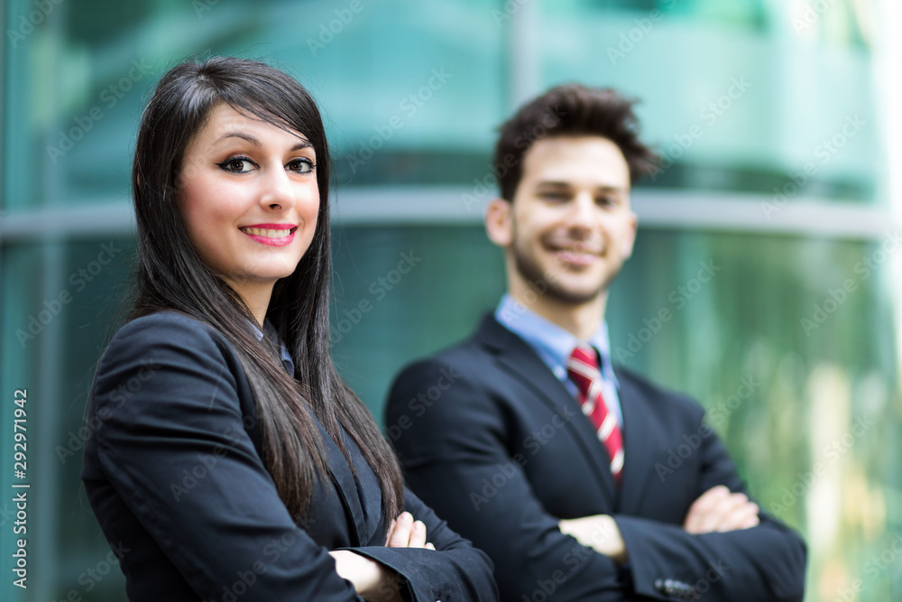 Business partners outdoor smiling confidently Business partners outdoor smiling confidently