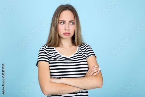 Beautiful young woman on blue background