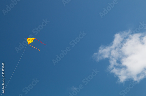 Colorful kite on a blue sky.