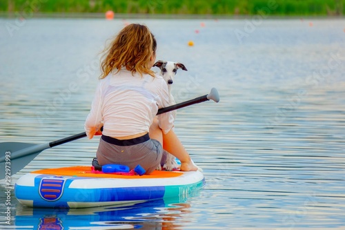 Girl and Dog on Kayak