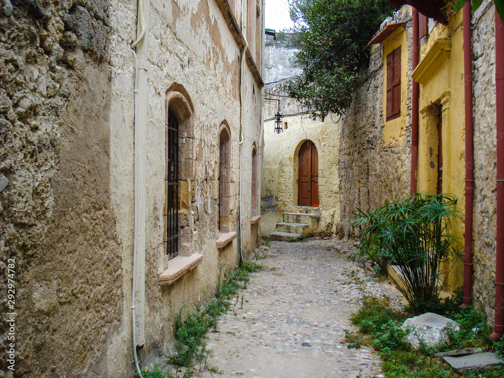 a narrow cozy street of the ancient Mediterranean city