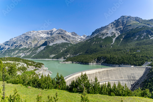 Huge dam with lake in the alps