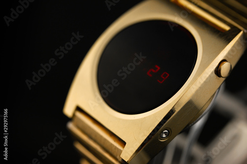 LED gold digital watch vintage retro wristwatch with red display 70s 80s isolated alarm multifunctional chronograph scratched steel used made in usa rare worn watch Armbanduhr golden luxurious side  photo