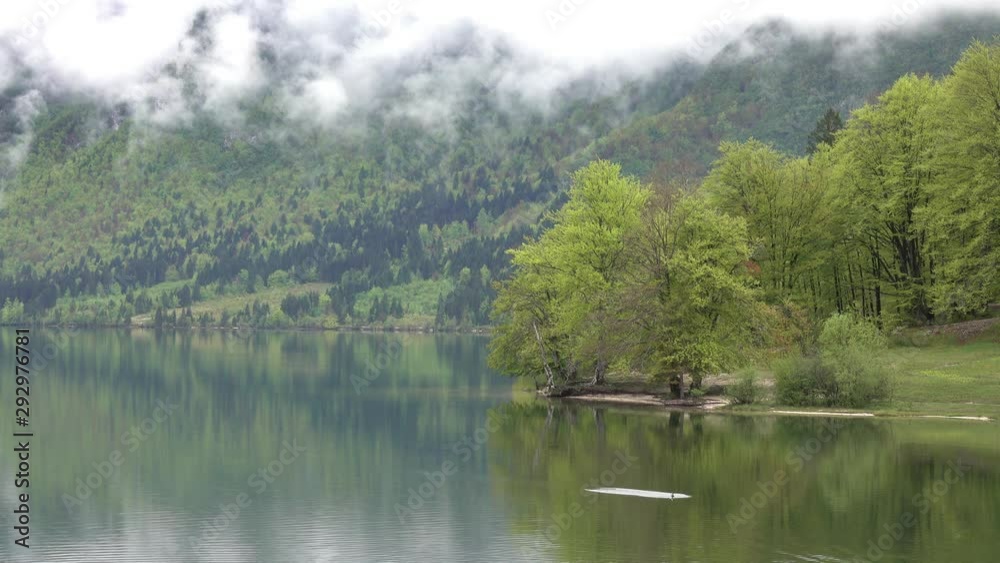 Bohinjsko jezero between mountains in Slovenia at morning spring, 4k Bohinjsko jezero between mountains in Slovenia at morning spring, 4k