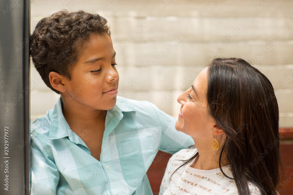 Portrait of a loving mom hugging her son. Portrait of a loving mom hugging her son.