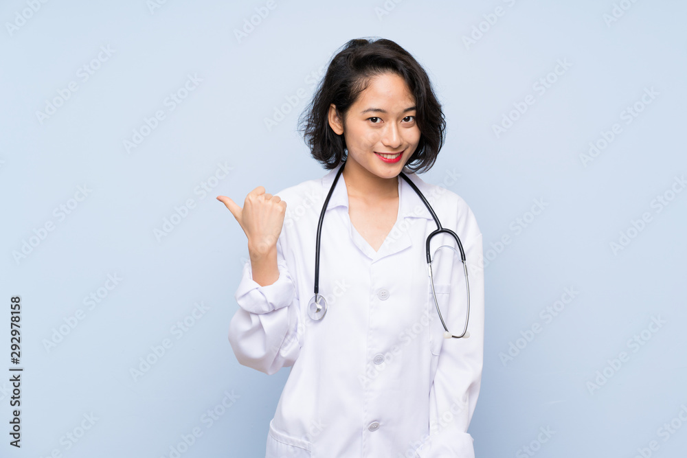 Doctor Asian woman pointing to the side to present a product Doctor Asian woman pointing to the side to present a product