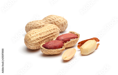 Dried peanuts in peel closeup isolated on white background