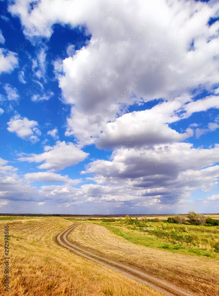 Country dirt road and blue sky