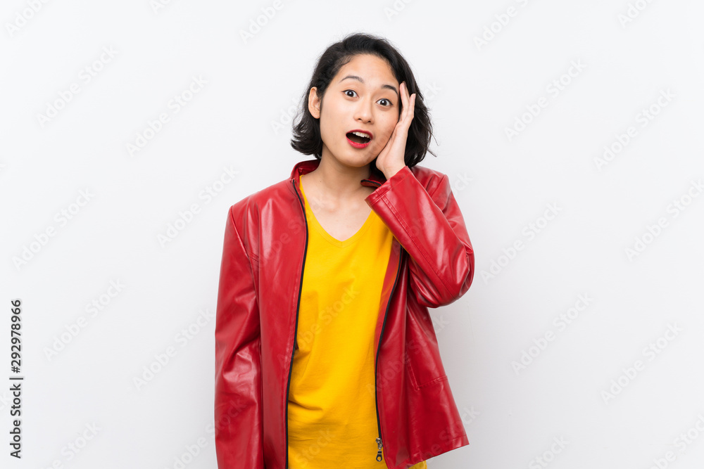Asian young woman over isolated white background with surprise and shocked facial expression Asian young woman over isolated white background with surprise and shocked facial expression