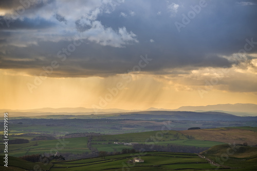 Setting sun highlighting rain over Yorkshire countryside
