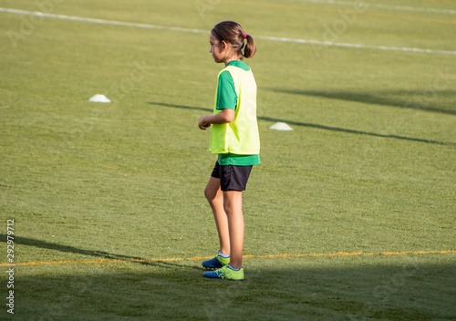 Little girl in a soccer training