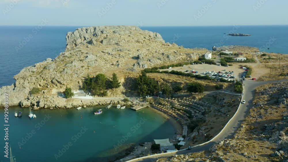 Aerial birds eye view video taken by drone of iconic Saint Paul bay in village of Lindos, Rhodes island, Dodecanese, Greece Aerial birds eye view video taken by drone of iconic Saint Paul bay in village of Lindos, Rhodes island, Dodecanese, Greece