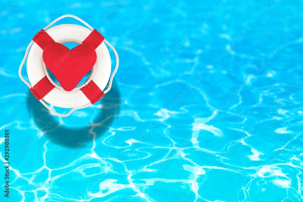 Life preserver floating in a clear pool water