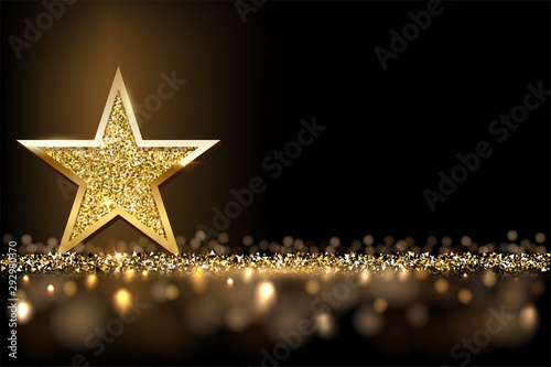 Fotografie, Obraz Golden sparkling star isolated on dark luxury horizontal background
